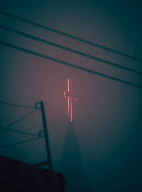 istock Glowing red cross atop a church building 1436922957