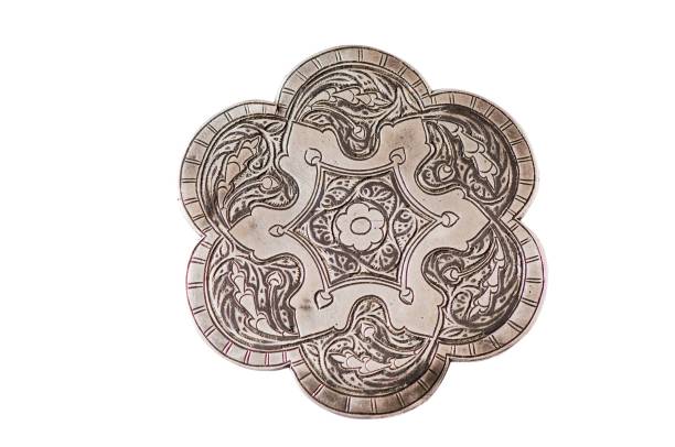 istock Artistic flower shape coin with beautiful engravings on a white background 1436923327
