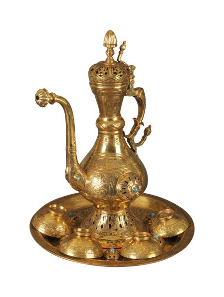 istock Copper teapot and cups with artistic chasing and engraving on a white background 1436923381