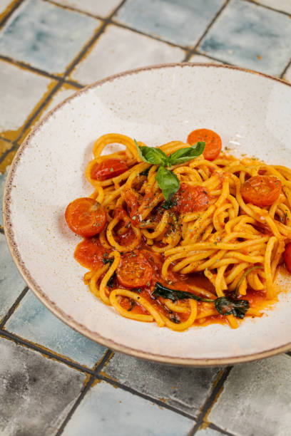 istock Spaghetti Pasta with tomato, Pasta with tomato sauce, Grey stone background. Top view. Close up. 1436925034