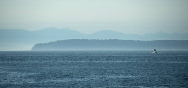 istock Boat and blue horizon line in Puget Sound 1436925964