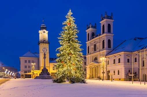 BANSKA BYSTRICA, SLOVAKIA - JANUARY 20, 2021: Snowy Christmas square in Banska Bystrica with Christmas tree. Beautiful holidays in heart of Slovakia. Winter monuments.