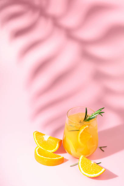 istock Summer cocktail with orange, rosemary, and ice. 1436937242