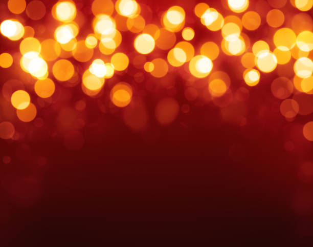 istock Christmas lights bokeh on dark red background 1436941095
