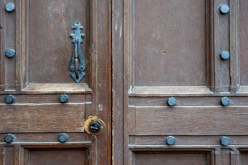 Old oak wooden doorway on a Cambridge University College.