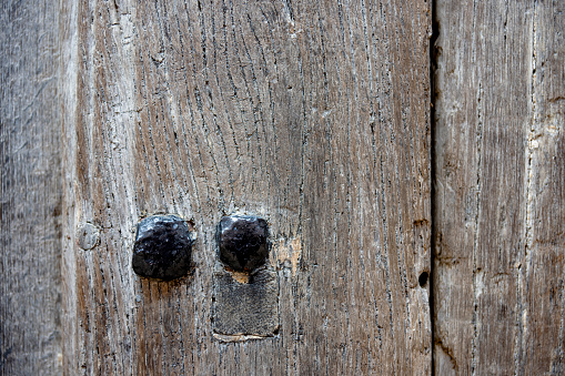 Old oak wooden doorway on a Cambridge University College.