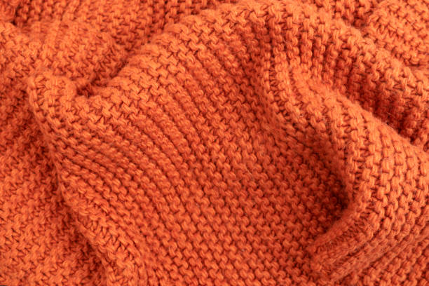 오렌지 니트 패브릭 질감 추상적인 배경. 모직 실로 만든 약간 구겨진 니트 담요. 겨울 또는 가을 따뜻한 배경 - voguing 뉴스 사진 이미지