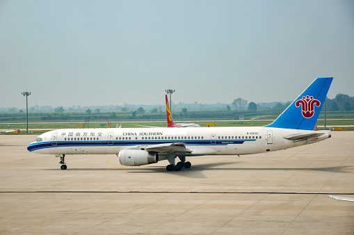 Xi'an, Shaanxi- September 8, 2010: An air travel from Beijing International Airport to Jiuzhai Huanglong Airport, Sichuan Province, via Xi‘an Xianyang Airport, Shaan'xi Province. Here is a Boeing 757 airplane of China Southern Airlines  in Xi’an Xianyang International Airport.