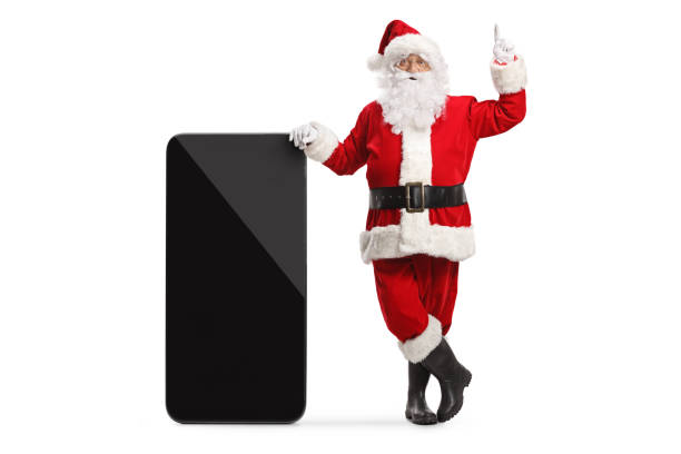istock Santa claus leaning on a big smartphone and pointing up 1436944834