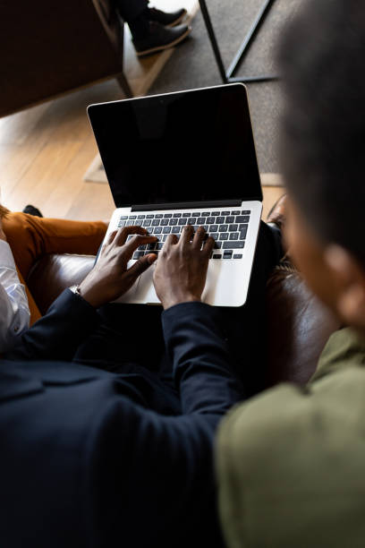 istock Young businesspeople preparing for a meeting using a laptop 1436945498