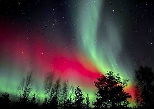 Northern lights in the night sky of Lapland, night landscape.