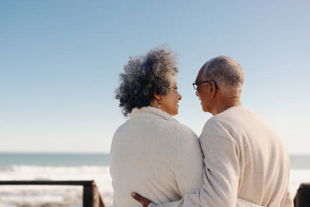 istock Mature lovebirds at the beach 1436950632