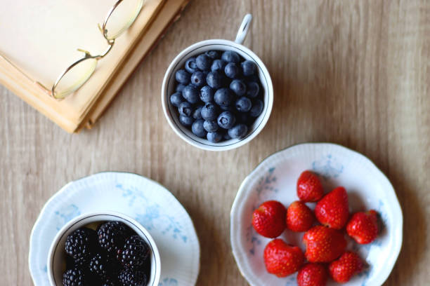 istock Various Berries, Book and Flowers 1436950957