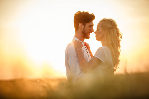 istock Romantic moment for a couple during sunset 1436952447
