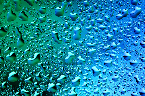Rain water droplets on waterproof fabric.