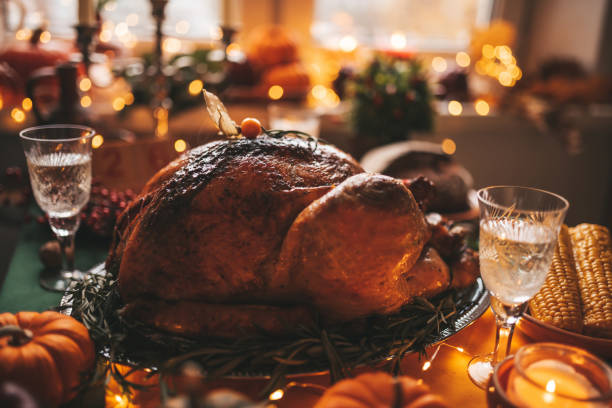 istock Thanksgiving holiday dinner table setting with fall decoration and pumpkins 1436957067