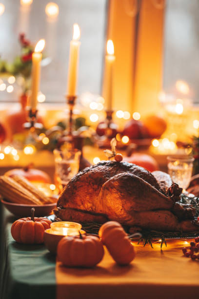 istock Thanksgiving holiday dinner table setting with fall decoration and pumpkins 1436957370