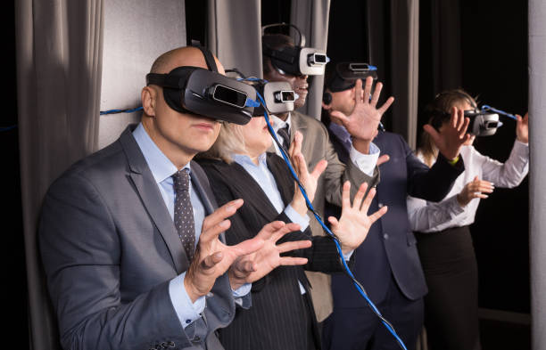 istock Frightened business people in vr glasses 1436957938