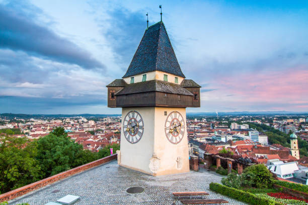 the landmark of graz called uhrturm - graz austria clock tower styria imagens e fotografias de stock