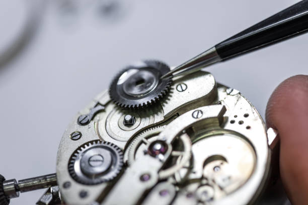 istock Closeup shot of a craftsman fixing gears on a clock 1436962856