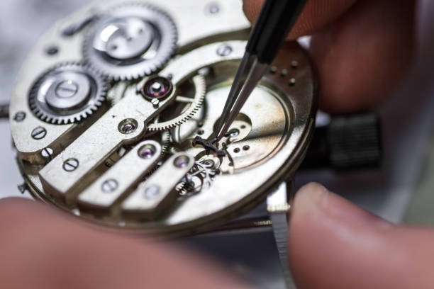 istock Closeup shot of a craftsman fixing gears on a clock 1436962863