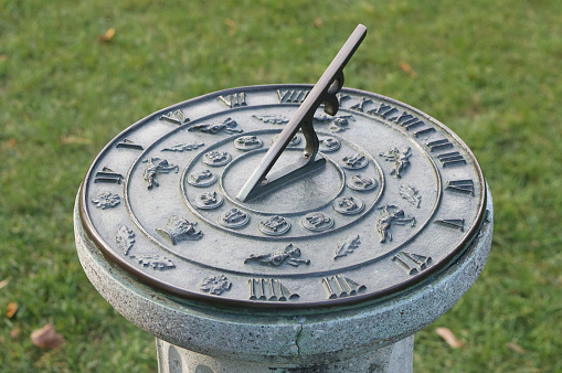 Montpelier Station, Virginia, USA - July 30, 2022: Close-up of a sundial in the Annie duPont Formal Garden located on the grounds of “James Madison’s Montpelier”, the home of Founding Father and United States President James Madison and his wife Dolly Madison.