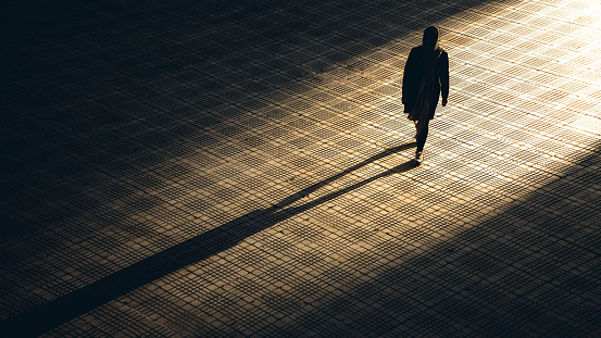 Karaj, Iran – August 29, 2020: a girl walk alone in silhouette