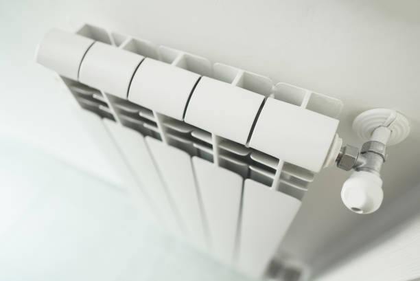 istock Metal radiator with adjustable valve inside the apartment. 1436968321