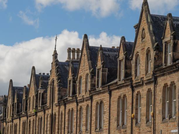 istock Building facade with cross under blue bright sky in Inverness 1436969808