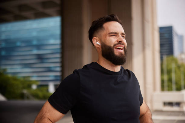 istock Fit young man taking a break from a run in the city 1436971605
