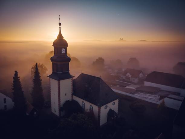 istock Church building facade in town during sunset 1436973218