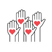 istock Raised up human hands with red hearts 1436973356
