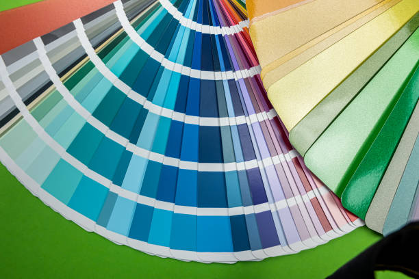 istock Color samples for painting on a wooden table close-up isolated. 1436974316