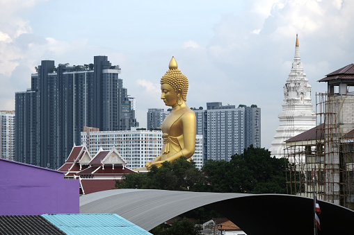 Bangkok skyline and Big Buddha at Wat Paknam Bhasicharoen, Phasi Charoen district, Thailand