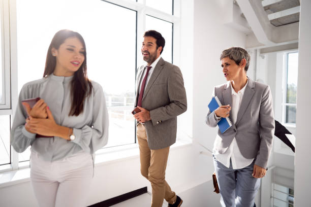 istock Team of corporate professionals in office corridor 1436978814