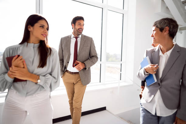 istock Team of corporate professionals in office corridor 1436978815