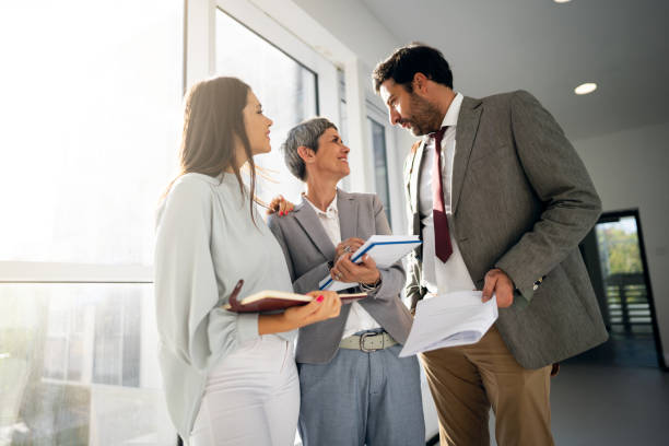 istock Team of corporate professionals in office corridor 1436979144