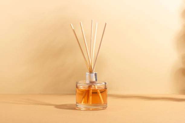 istock reed diffuser bottle on a beige background. Incense sticks for the home with a floral scent. The concept of eco-friendly fragrance for the home 1436979242