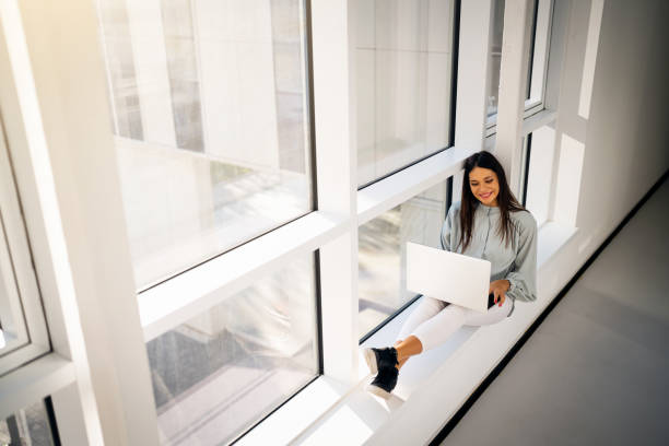 istock College student using laptop in the hall of university building 1436980710