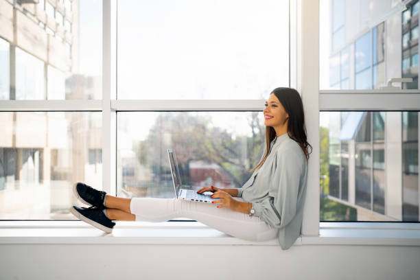 istock College student using laptop in the hall of university building 1436980711