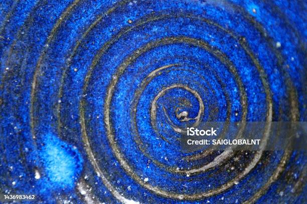 Platter With A Swirling Design Vividly Baked With A Cobalt Blue Glaze Pottery Texture Stock Photo - Download Image Now