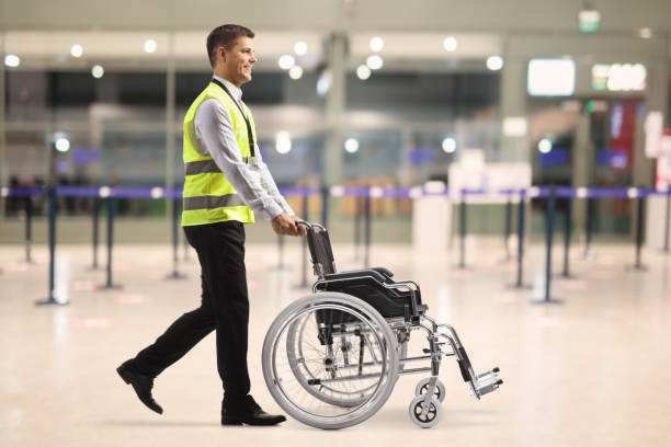 istock Airport employee pushing an empty wheelchair 1436983811