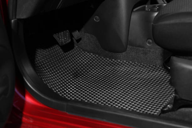 istock Black rubber car floor mat in auto 1436987997