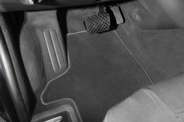 istock Grey soft floor carpet in car, closeup 1436988598