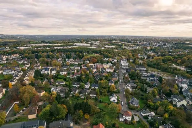 An aerial view of the buildings and green trees in the town of Solingen, Germany