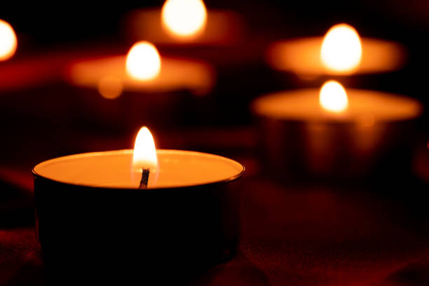 istock Candle light and red fabric background in the darkness with space for text or image. valentine love concept 1436990457
