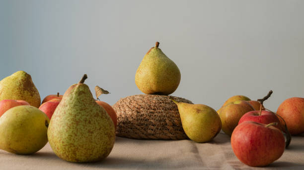 Single pear up to an upside down  basket stock photo