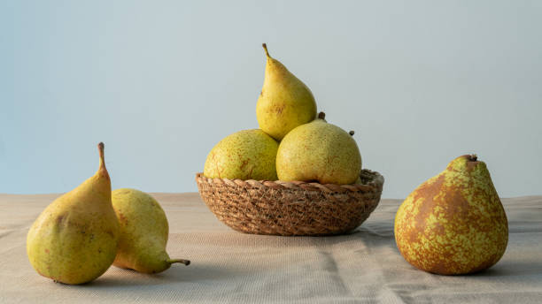 istock Green pears in a rattan basket with clear background 1436991365
