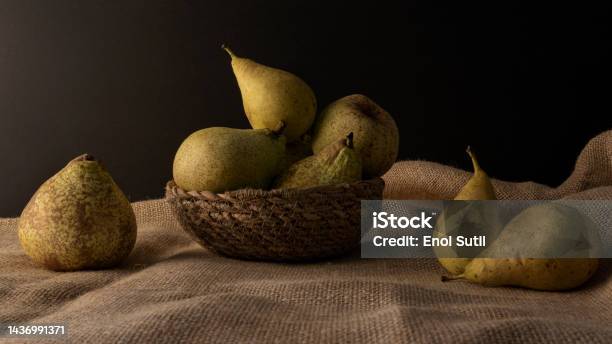 Close Up Of A Freshly Picked Pears Over A Jute Surface On Dark Backdrop Stock Photo - Download Image Now
