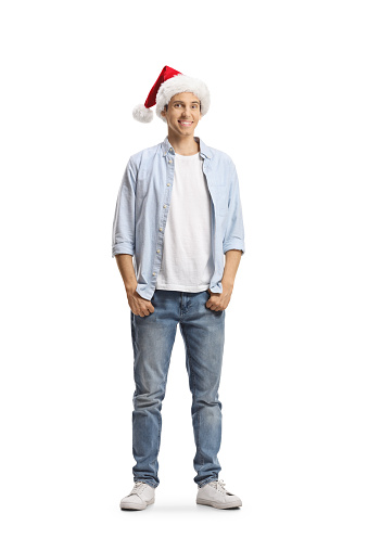 Casual young man wearing a santa claus hat isolated on white background